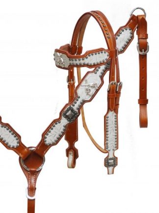 Embossed leather headstall and breast collar set with crossed guns conchos.